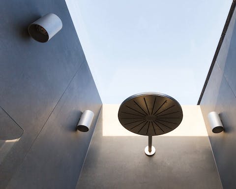 A rainfall shower with a skylight