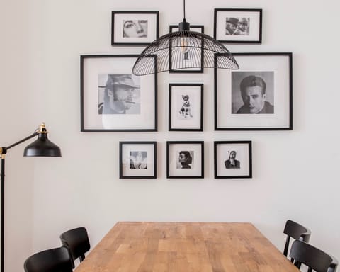The wall of black-and-white photos