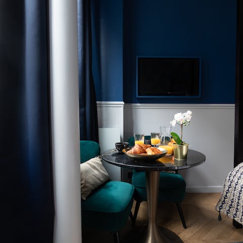 Sit down at the romantic window-side table for coffee and croissants ahead of a day of sightseeing