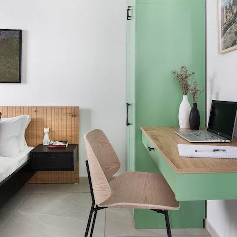 Jump on Zoom calls and fire off emails from your sleek desk space