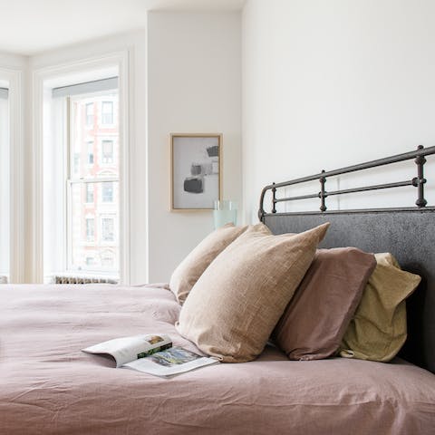 A rustic bedroom with wonderful linen bedsheets 