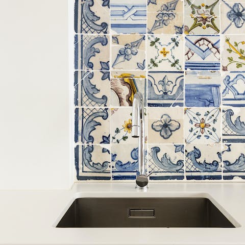 Wash up with one eye on the traditional azulejos in the kitchen