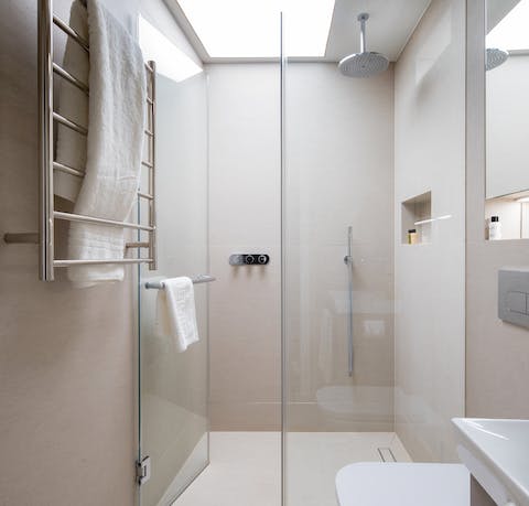 Take a long soak under the rainfall shower after a day of sightseeing