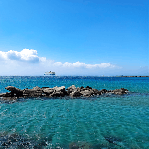 Swim in the sea at Agios Fokas Beach – it's a short walk away