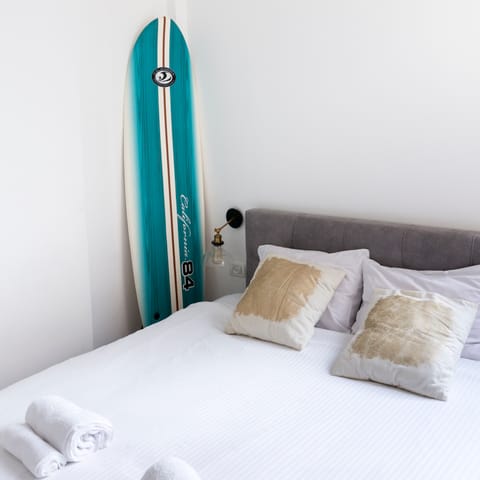 The surf board in the master bedroom
