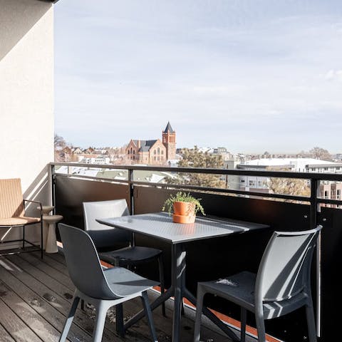 Take a freshly brewed coffee out onto the balcony