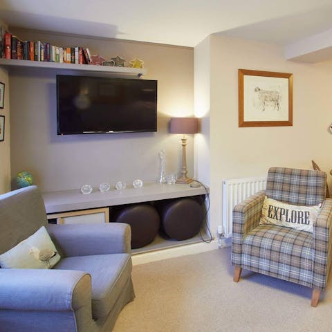 Sink into the comfy armchairs and sofa for a movie night in the evening after a long day