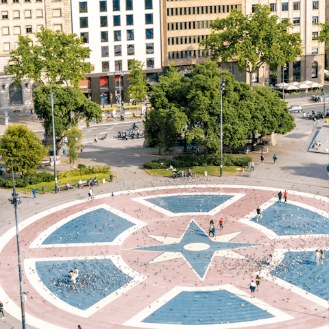 Stroll to nearby Plaça de Catalunya to sip coffee and watch the world go by