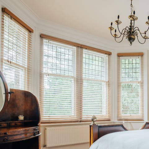 Pull up the blinds and let the natural light flood in from the huge set of bay windows