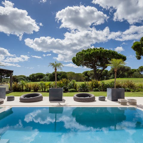Take a post-golf dip in the pristine pool overlooking the course