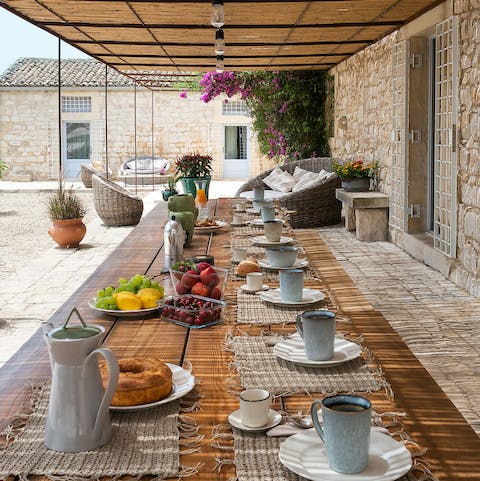 Share leisurely meals around the outdoor dining table