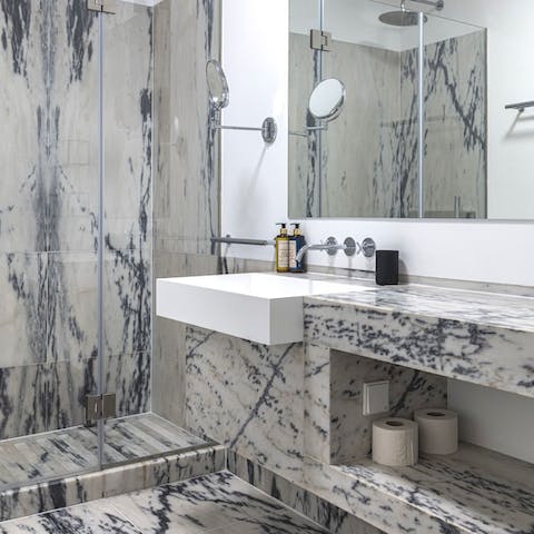 Get ready for a night out in the marble-clad bathroom