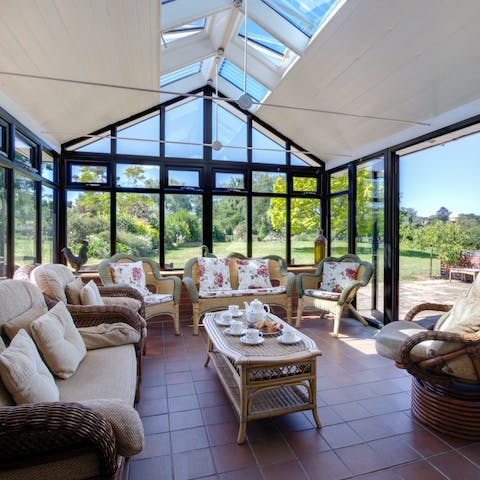 Wake up with a cup of coffee in your bright and airy conservatory