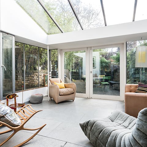 Enjoy a good book in the light and airy glass annex