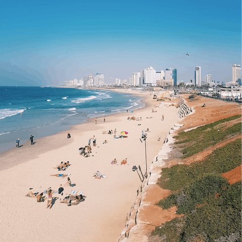 Bask in the sun on Tel Aviv's glorious city beaches – Gordon Beach is the closest just a nine-minute walk away