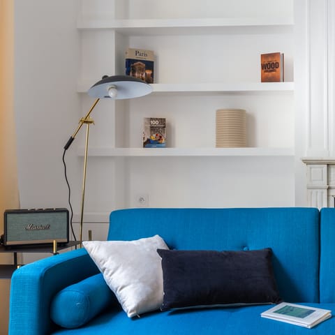 Blue linen sofa and a Marshall amp