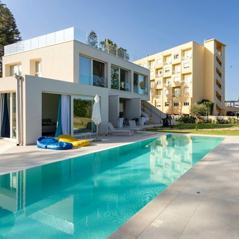 Dive into this modern villa's private pool