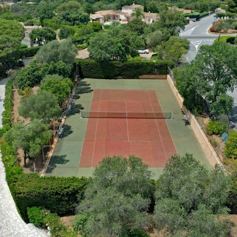 Get competitive on your private tennis court
