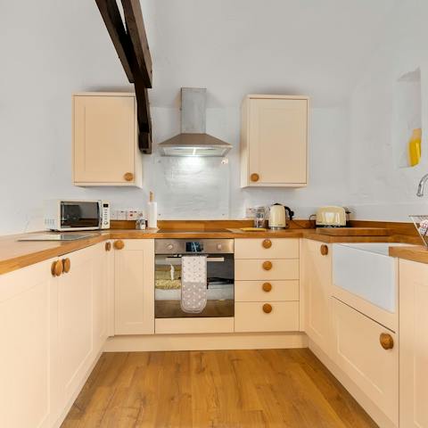 Whip up a tasty dinner in the quaint kitchen in the afternoon, with everything you need