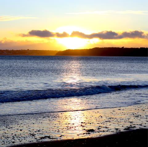 Drive to Paignton Beach for a stroll along the golden sands or long pier