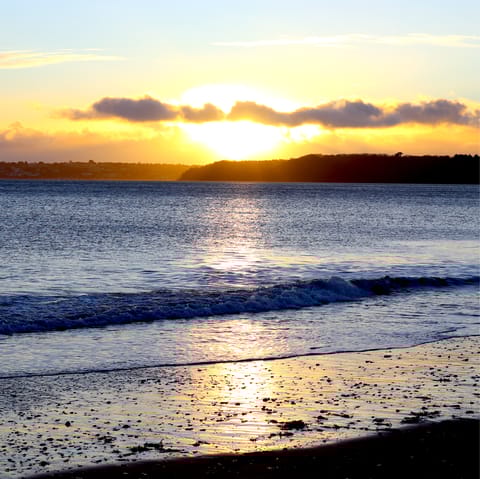 Drive to Paignton Beach for a stroll along the golden sands or long pier