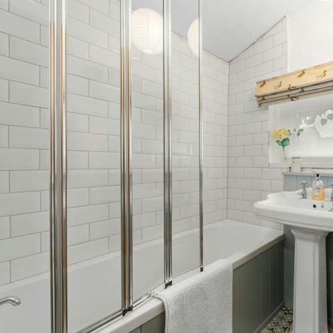 Sink into the hot waters of the bathtub after a long day of exploring