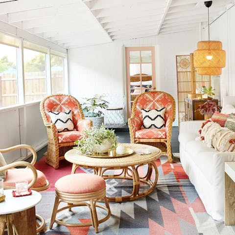 Enjoy a cup of tea in the bohemian-inspired screened porch