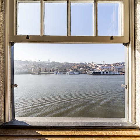 Watch the boats drift by on the Douro River from your living room
