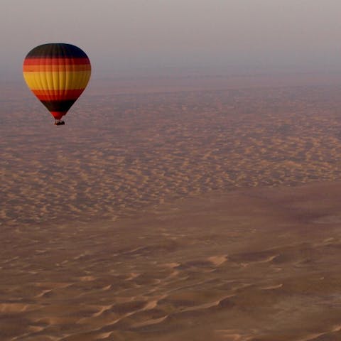 Soar above the desert in a hot air balloon