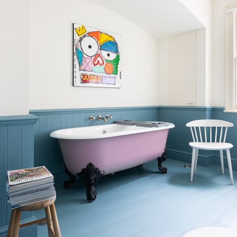 Have a soak in the mauve roll-top bath after a busy day in London