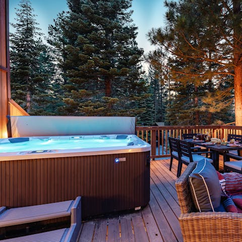 Savour long soaks in the hot tub with idyllic views across the trees