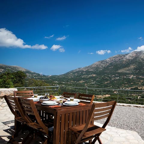 Enjoy souvlaki and dolmades on the terrace with stunning mountain views 