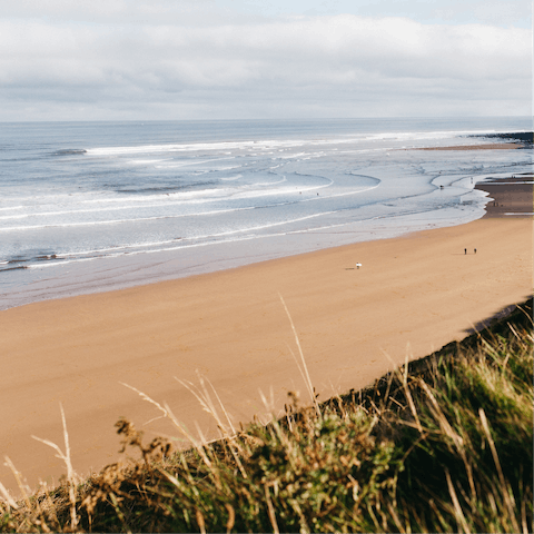 Have a stroll along Beadnell Bay, a ten-minute walk away