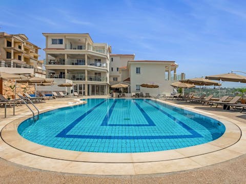 Relax on a lounger or splash about in the communal pool