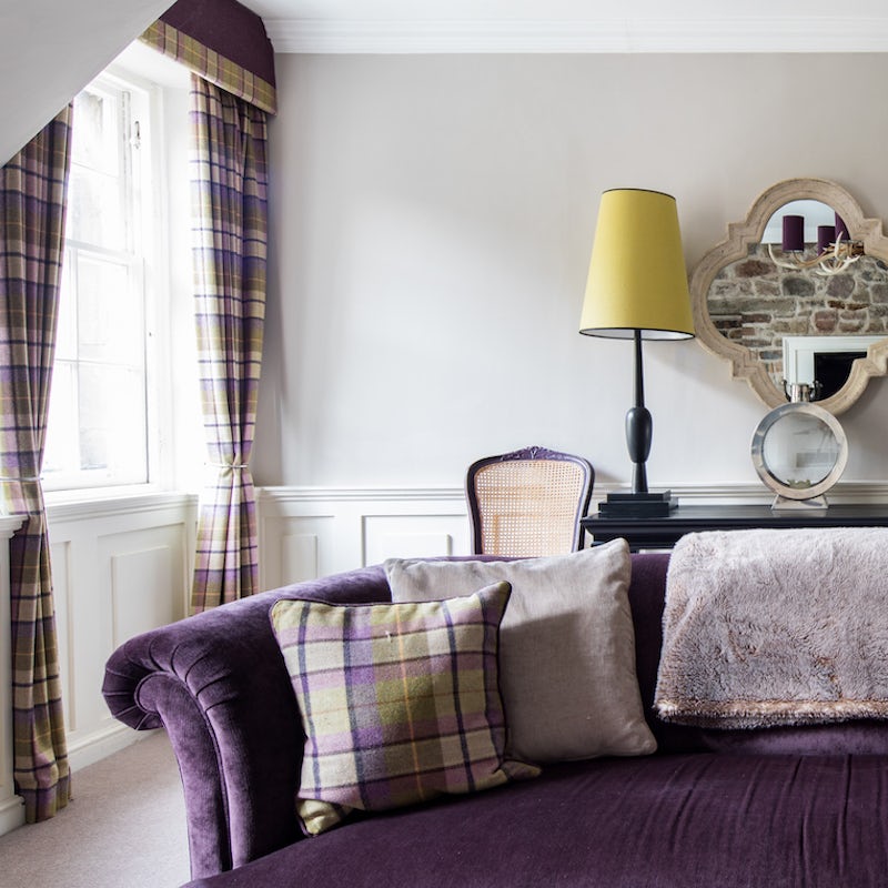 Curl up on the plush sofa with a glass of scotch and a good book
