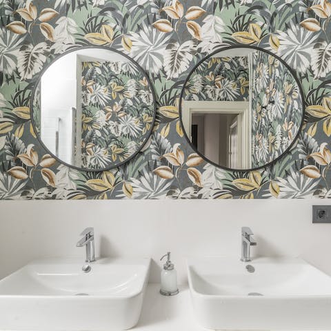 Pamper yourself in the sleek jungle-print bathroom