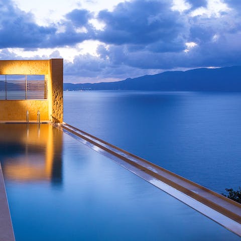 Swim in the infinity pool while you gaze out at stunning skyscapes and deep blue sea