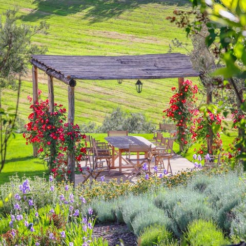 Dine alfresco under the pretty pergola after playing a round of golf, three minutes away