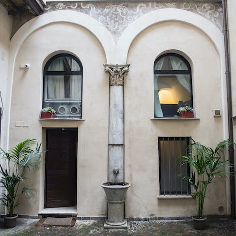 Enter through the historic courtyard and into your peaceful Roman home