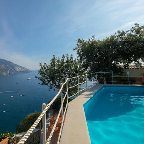 Swim in the private pool with far-reaching sea views