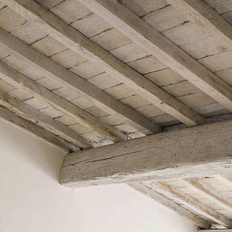 The sloped wooden ceiling