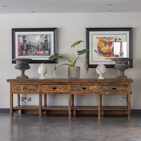 Admire the currated artwork and vintage pieces dotted about the home