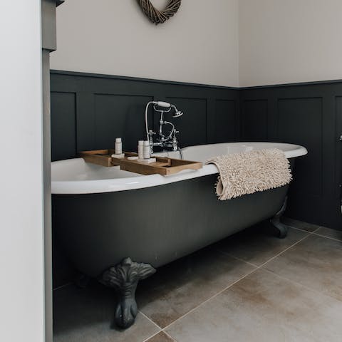 Take a moment for yourself in the cast iron bathtub