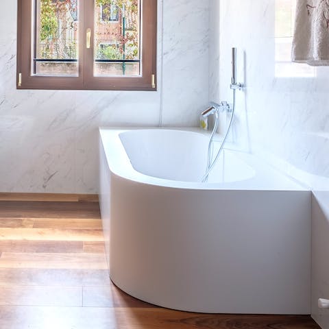 Soak in the luxurious bathtub