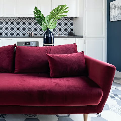 Open a bottle of chianti and get comfy on the red velvet sofa