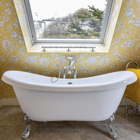 Soak away the evening in the roll top bath