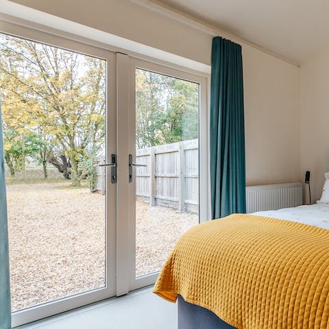Step right into nature from the French doors in the master bedroom