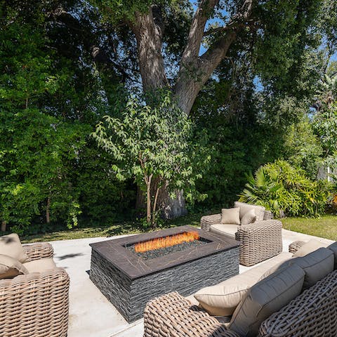 Gather round the fire pit for a cosy evening with good company and drinks at sun set