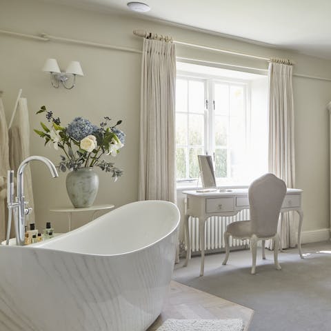 Treat yourself to a pampering session in the freestanding tub in the master bedroom