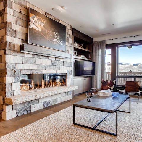 Warm up next to the contemporary stone fireplace